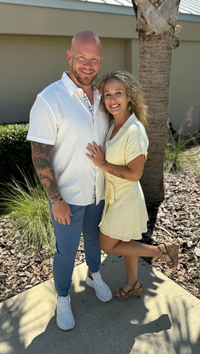 Jason and Monica Slegers, owners of Fence Freaks USA, standing together outside their Florida home